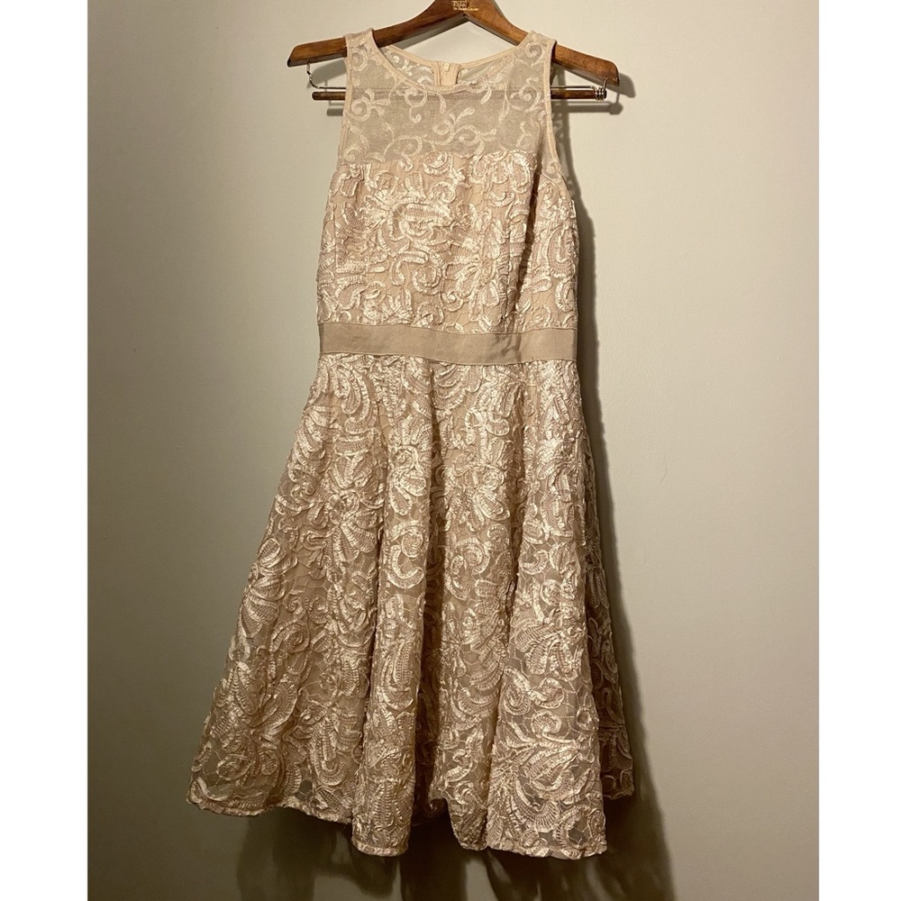 Champagne color, formal dress, size 8, mid length. Can go wedding or casual!